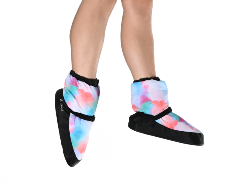 Colorful slip-on warm up booties with black velcro bands worn by a dancer, featuring the brand Dttrol, Dance to the Rhythm of Life. 